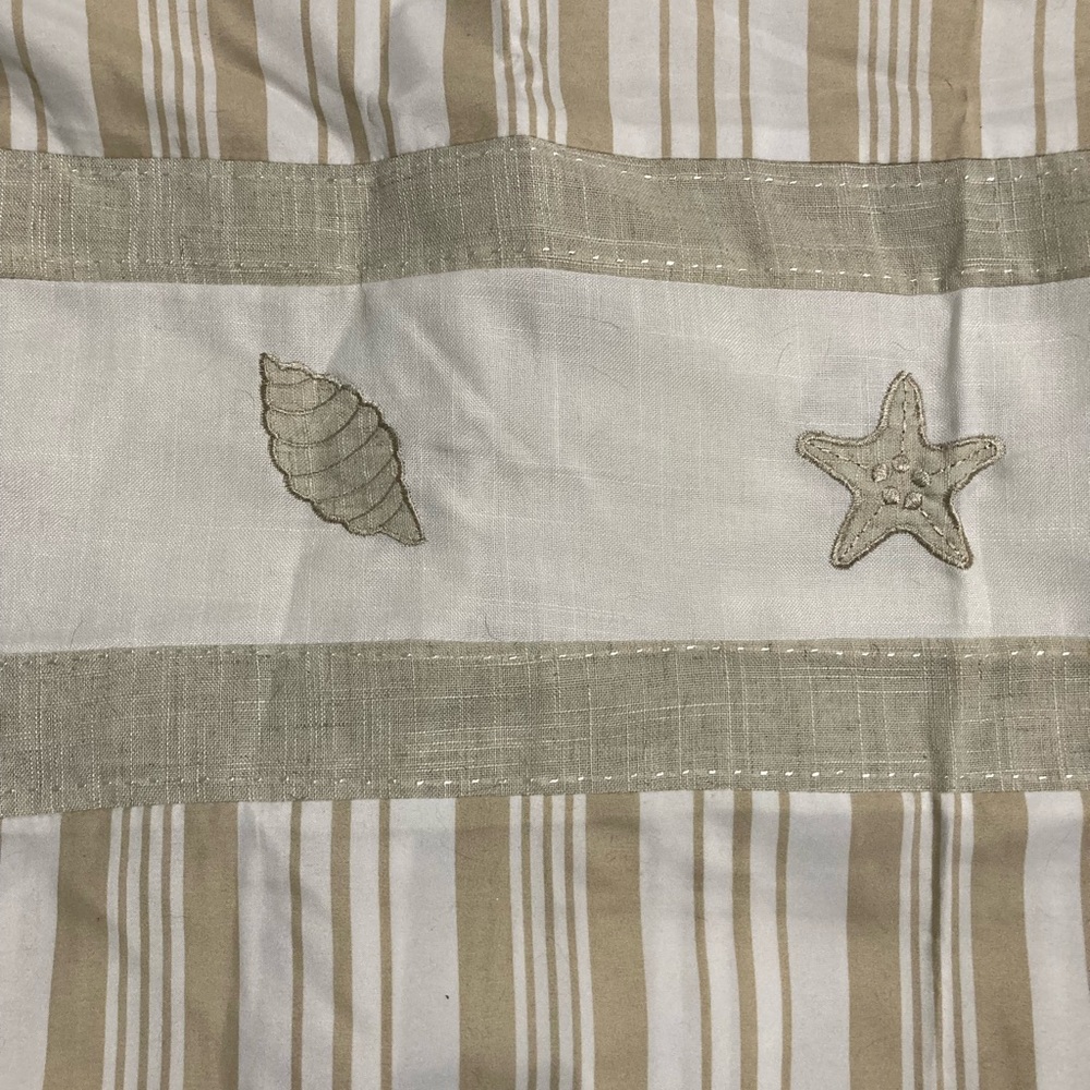 Fabric shower curtain with embroidered shells and new shower hooks